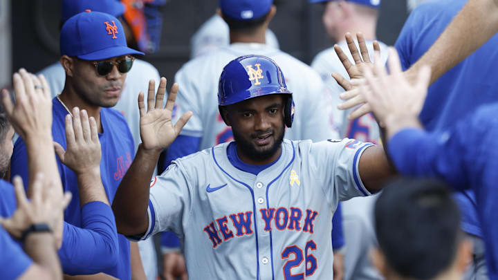 Sep 1, 2024; Chicago, Illinois, USA; New York Mets infielder Pablo Reyes (26) celebrates with teammates after scoring against the Chicago White Sox during the ninth inning at Guaranteed Rate Field. Mandatory Credit: Kamil Krzaczynski-Imagn Images