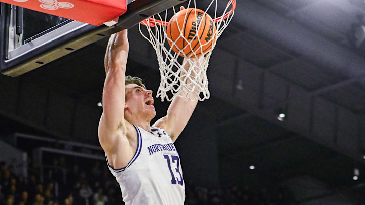 Dec 29, 2024; Evanston, Illinois, USA;  Northwestern Wildcats guard Brooks Barnhizer (13) dunks the ball against the Northeastern Huskies during the second half at Welsh-Ryan Arena. Mandatory Credit: Matt Marton-Imagn Images