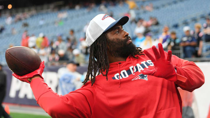August 8, 2024; Foxborough, MA, USA;  New England Patriots linebacker Matthew Judon (9) plays catch with fans before a game against the Carolina Panthers at Gillette Stadium. Mandatory Credit: Eric Canha-USA TODAY Sports
