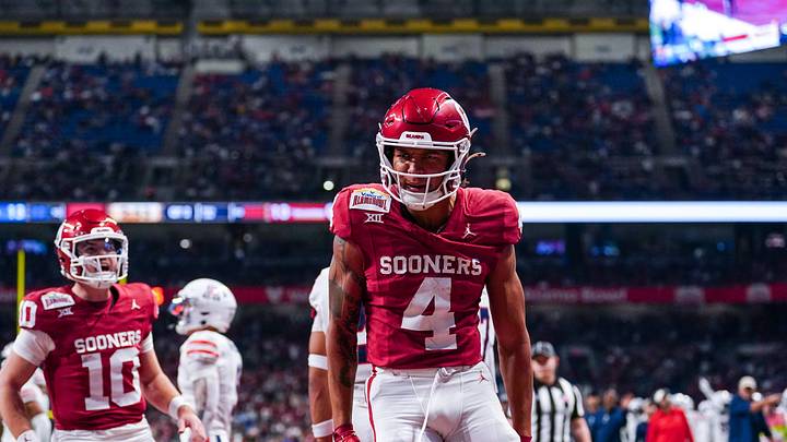 Dec 28, 2023; San Antonio, TX, USA;  Oklahoma Sooners wide receiver Nic Anderson (4) celebrates a touchdown catch in the first half against the Arizona Wildcats at Alamodome. Mandatory Credit: Daniel Dunn-Imagn Images