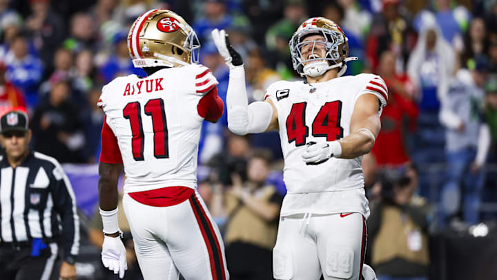 Oct 10, 2024; Seattle, Washington, USA; San Francisco 49ers fullback Kyle Juszczyk (44) celebrates with wide receiver Brandon Aiyuk (11) after rushing for a touchdown against the Seattle Seahawks at Lumen Field. Mandatory Credit: Joe Nicholson-Imagn Images