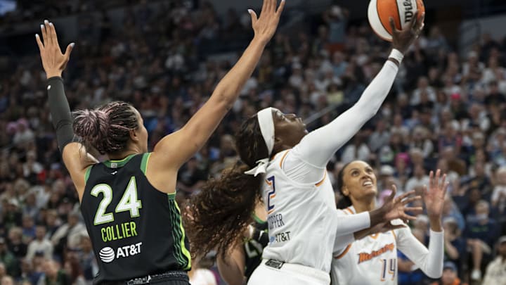 Sep 21, 2025; Minneapolis, Minnesota, USA; Phoenix Mercury guard Kahleah Copper (2) drives to the basket and shoots ht ball past Minnesota Lynx forward Napheesa Collier (24) in the second half during game one of the second round for the 2025 WNBA Playoffs at Target Center. Mandatory Credit: Jesse Johnson-Imagn Images