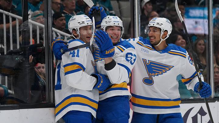 Mar 30, 2026; San Jose, California, USA; St. Louis Blues defenseman Theo Lindstein (41) is congratulated after scoring by left winger Jake Neighbours (63) and right winger Jordan Kyrou (25) during the first period against the San Jose Sharks at SAP Center at San Jose. Mandatory Credit: David Gonzales-Imagn Images Mar 30, 2026; San Jose, California, USA; St. Louis Blues defenseman Theo Lindstein (41) is congratulated after scoring by left winger Jake Neighbours (63) and right winger Jordan Kyrou (25) during the first period against the San Jose Sharks at SAP Center at San Jose. Mandatory Credit: David Gonzales-Imagn Images