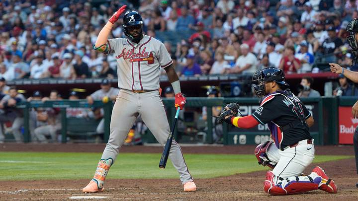 Apr 4, 2026; Phoenix, Arizona, USA;  Atlanta Braves outfielder Michael Harris II (23) taps his helmet to initiate an ABS challenge during the ninth inning of a game against the Arizona Diamondbacks at Chase Field. Mandatory Credit: Allan Henry-Imagn Images