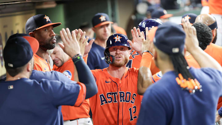 Sep 6, 2024; Houston, Texas, USA;  Houston Astros right fielder Ben Gamel (12) celebrates his run with teammates in the dugout against the Arizona Diamondbacks in the second inning at Minute Maid Park. Mandatory Credit: Thomas Shea-Imagn Images