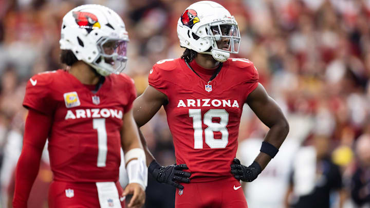 Sep 29, 2024; Glendale, Arizona, USA; Arizona Cardinals wide receiver Marvin Harrison Jr. (18) alongside quarterback Kyler Murray (1) against the Washington Commanders in the first half at State Farm Stadium. Mandatory Credit: Mark J. Rebilas-Imagn Images