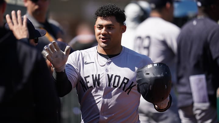 Sep 22, 2024; Oakland, California, USA; New York Yankees left fielder Jasson Dominguez (89) is congratulated by teammates after hitting a two-run home run against the Oakland Athletics in the second inning at the Oakland-Alameda County Coliseum. Sep 22, 2024; Oakland, California, USA; New York Yankees left fielder Jasson Dominguez (89) is congratulated by teammates after hitting a two-run home run against the Oakland Athletics in the second inning at the Oakland-Alameda County Coliseum.