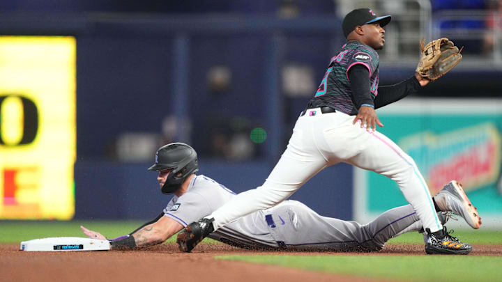 Mar 28, 2026; Miami, Florida, USA; Colorado Rockies center fielder Brenton Doyle (9) steals second base in the second inning as Miami Marlins second baseman Xavier Edwards (9) waits for the ball at loanDepot Park. Mandatory Credit: Jim Rassol-Imagn Images Mar 28, 2026; Miami, Florida, USA; Colorado Rockies center fielder Brenton Doyle (9) steals second base in the second inning as Miami Marlins second baseman Xavier Edwards (9) waits for the ball at loanDepot Park. Mandatory Credit: Jim Rassol-Imagn Images