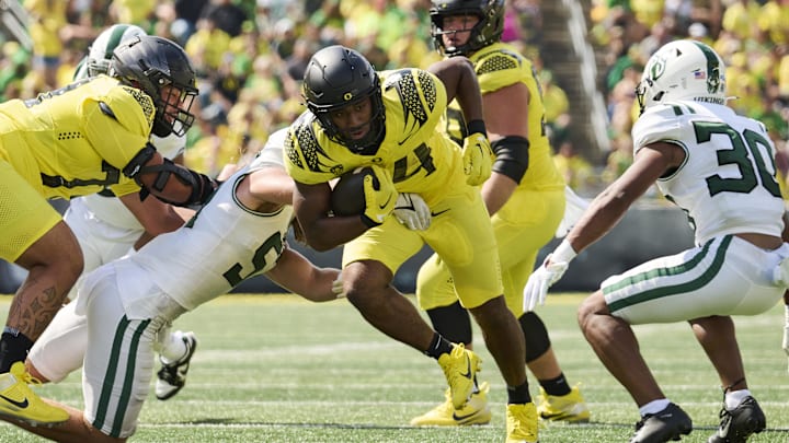 Sep 2, 2023; Eugene, Oregon, USA; Oregon Ducks running back Dante Dowdell (24) breaks a tackle to
