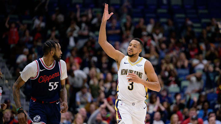 Mar 11, 2025; New Orleans, Louisiana, USA; New Orleans Pelicans guard CJ McCollum (3) blows a chef’s kiss after a three-point basket against the Los Angeles Clippers during the fourth quarter at Smoothie King Center. Mandatory Credit: Matthew Hinton-Imagn Images