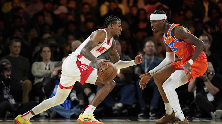 Dec 14, 2024; Las Vegas, Nevada, USA; Houston Rockets guard Jalen Green (4) controls the ball against Oklahoma City Thunder guard Shai Gilgeous-Alexander (2) during the second quarter in a semifinal of the 2024 Emirates NBA Cup at T-Mobile Arena. Mandatory Credit: Kyle Terada-Imagn Images