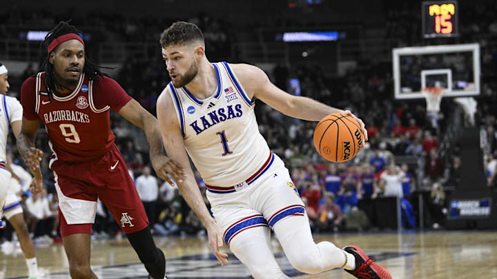 Mar 20, 2025; Providence, RI, USA; Kansas Jayhawks center Hunter Dickinson (1) controls the ball during the first quarter against Arkansas Razorbacks forward Jonas Aidoo (9) at Amica Mutual Pavilion. Mandatory Credit: Eric Canha-Imagn Images Mar 20, 2025; Providence, RI, USA; Kansas Jayhawks center Hunter Dickinson (1) controls the ball during the first quarter against Arkansas Razorbacks forward Jonas Aidoo (9) at Amica Mutual Pavilion. Mandatory Credit: Eric Canha-Imagn Images