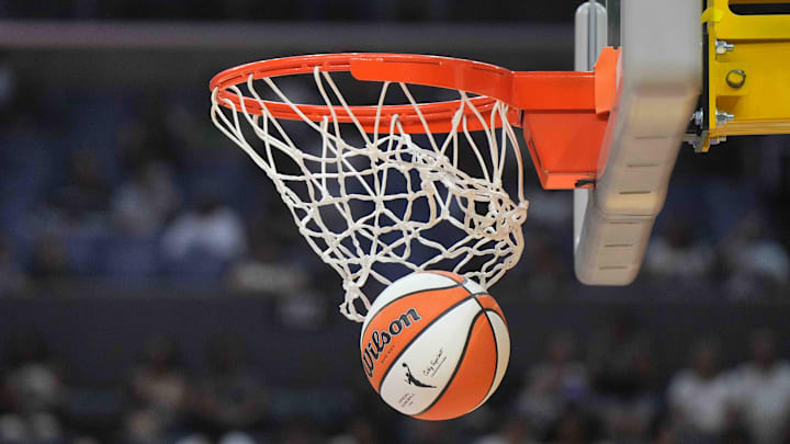 Jul 5, 2024; Los Angeles, California, USA; A WIlson official WNBA Evo NXT basketball approaches the rim and the net at Crypto.com Arena. Mandatory Credit: Kirby Lee-Imagn Images