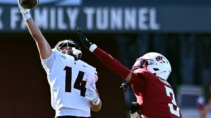 Duquesne Dukes wide receiver Ryan Petras (14) makes the one-handed catch against Washington State Cougars safety Jaylen Thomas (3) during the second half at Gesa Field at Martin Stadium. Duquesne Dukes wide receiver Ryan Petras (14) makes the one-handed catch against Washington State Cougars safety Jaylen Thomas (3) during the second half at Gesa Field at Martin Stadium.