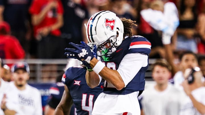 Sep 12, 2025; Tucson, Arizona, USA; Arizona Wildcats defensive back Genesis Smith (12) reacts after a play against the Kansas State Wildcats during the second quarter of the game at Arizona Stadium. Mandatory Credit: Aryanna Frank-Imagn Images
