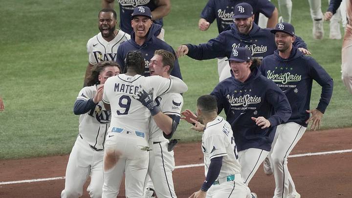 Tampa Bay Rays second baseman Ben Williamson (15) celebrates with teammates including Tampa Bay Rays shortstop Jorge Mateo (9) after he hit the game winning walk off RBI single off of Milwaukee Brewers pitcher Shane Drohan (55) during the twelfth inning during Game 4 of the Brewers 4-3 World Series loss at Tropicana Field in St. Petersburg, Fla. on Oct 27, 2026.