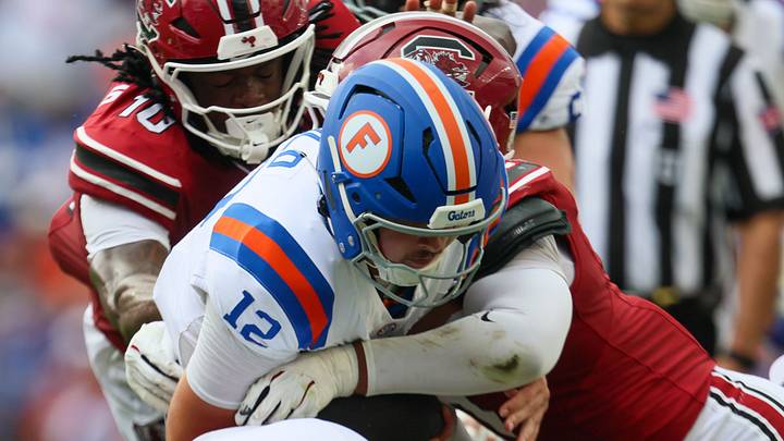 Florida quarterback Aaron Philo (12) runs against South Carolina during the first half of an NCAA football at Steve Spurrier Field at Ben Hill Griffin Stadium in Gainesville, FL on Saturday, October 10, 2026. [Alan Youngblood/Gainesville Sun]