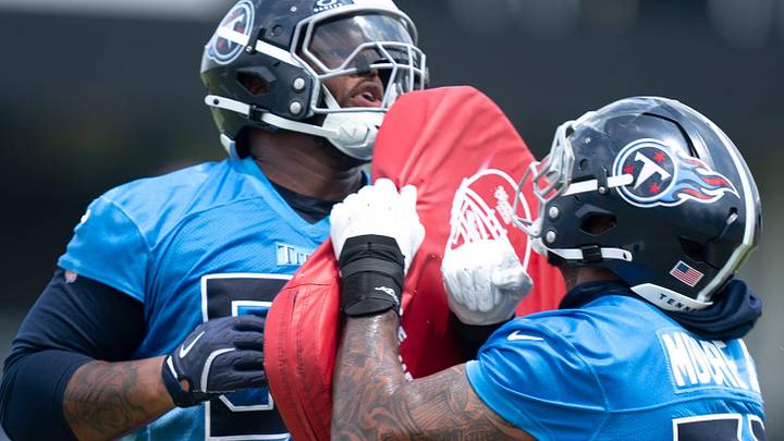 Tennessee Titans tackle JC Latham (55) and Dan Moore Jr. (75) work out during OTAs at Ascension Saint Thomas Sports Park in Nashville, Tenn., Tuesday, June 3, 2025.