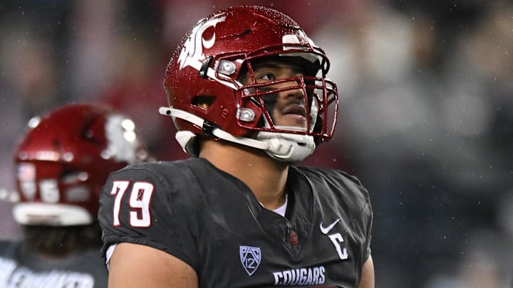 Nov 9, 2024; Pullman, Washington, USA; Washington State Cougars offensive lineman Fa'alili Fa'amoe (79) looks up at the video board against the Utah State Aggies in the second half at Gesa Field at Martin Stadium. Mandatory Credit: James Snook-Imagn Images
