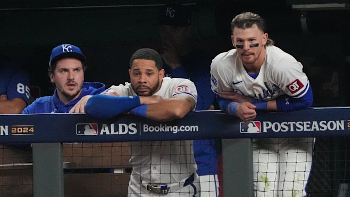 Oct 10, 2024; Kansas City, Missouri, USA; Kansas City Royals first baseman Vinnie Pasquantino (9), outfielder Tommy Pham (22) and shortstop Bobby Witt Jr. (7) watch play from the dugout during the seventh inning against the New York Yankees during game four of the ALDS for the 2024 MLB Playoffs at Kauffman Stadium. Mandatory Credit: Denny Medley-Imagn Images