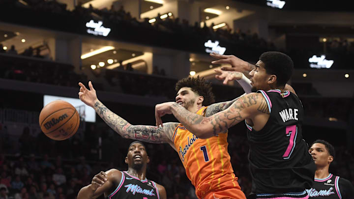 Charlotte Hornets guard LaMelo Ball (1) drives in against Miami Heat center Kel’el Ware 