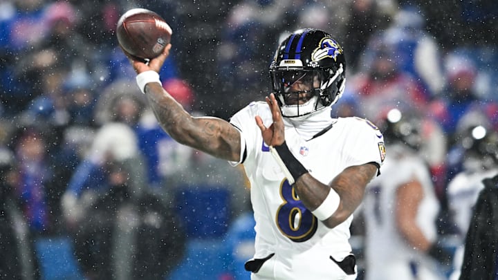 Jan 19, 2025; Orchard Park, New York, USA; Baltimore Ravens quarterback Lamar Jackson (8) throws the ball during warm ups before the game against the Buffalo Bills in a 2025 AFC divisional round game at Highmark Stadium. Mandatory Credit: Mark Konezny-Imagn Images