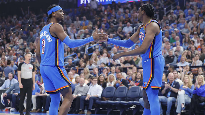 Apr 2, 2025; Oklahoma City, Oklahoma, USA; Oklahoma City Thunder guard Shai Gilgeous-Alexander (2) and forward Jalen Williams (8) high five after a play against the Detroit Pistons during the first quarter at Paycom Center.