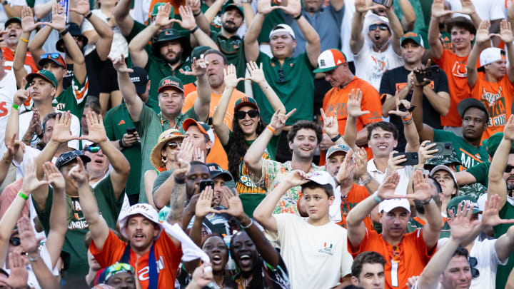 Aug 31, 2024; Gainesville, Florida, USA; Miami Hurricanes fans cheer against the Florida Gators after a game at Ben Hill Griffin Stadium. Mandatory Credit: Matt Pendleton-USA TODAY Sports Aug 31, 2024; Gainesville, Florida, USA; Miami Hurricanes fans cheer against the Florida Gators after a game at Ben Hill Griffin Stadium. Mandatory Credit: Matt Pendleton-USA TODAY Sports