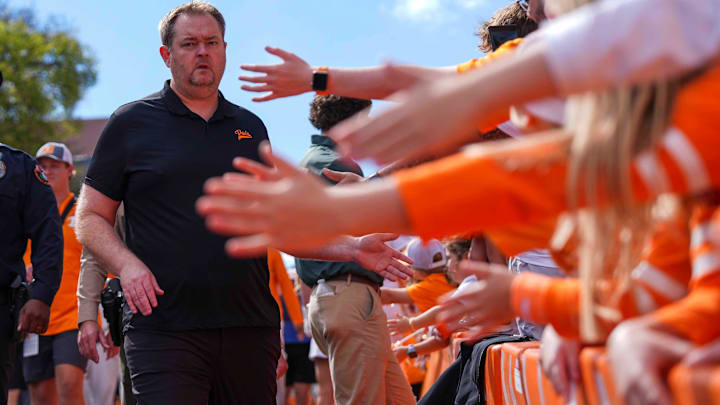 Tennessee coach Josh Heupel high-fives fans at the Vol Walk before a college football game between Tennessee and Arkansas at Neyland Stadium in Knoxville, Tenn., on Oct. 11, 2025.