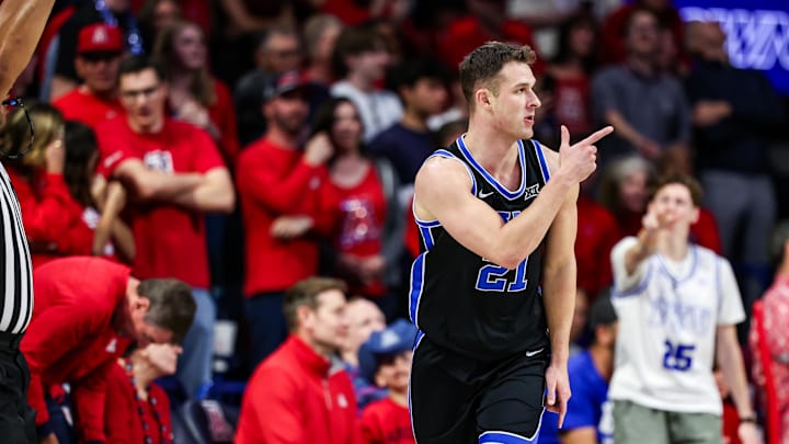Feb 22, 2025; Tucson, Arizona, USA; BYU Cougars guard Trevin Knell (21) points after he makes a three-point basket during the second half against the Arizona Wildcats at McKale Center. Mandatory Credit: Aryanna Frank-Imagn Images