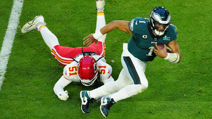 Eagles quarterback Jalen Hurts scrambles for extra yardage during the first half of Super Bowl 57 against the Chiefs on Feb. 12, 2023.