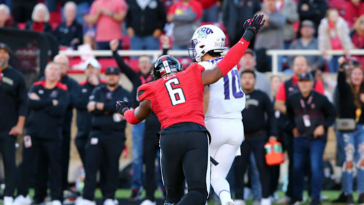 Nov 2, 2023; Lubbock, Texas, USA; Texas Tech Red Raiders defensive end Myles Cole (6) pressures Texas Christian Horned Frogs quarterback Josh Hoover (10) in the first half at Jones AT&T Stadium and Cody Campbell Field. Mandatory Credit: Michael C. Johnson-Imagn Images