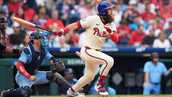 Jun 14, 2025; Philadelphia, Pennsylvania, USA; Philadelphia Phillies outfielder Brandon Marsh (16) hits a single against the Toronto Blue Jays in the fifth inning at Citizens Bank Park.