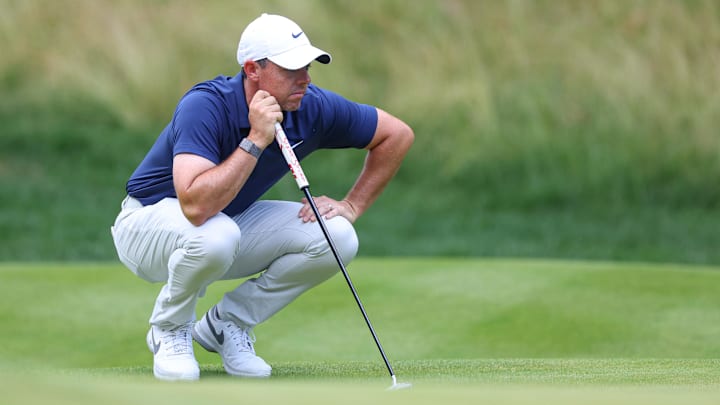 Jun 25, 2023; Cromwell, Connecticut, USA; Rory McIlroy looks over his putt on the 14th green during