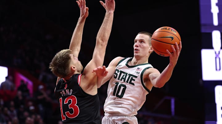 Jan 27, 2026; Piscataway, New Jersey, USA; Michigan State Spartans guard Denham Wojcik (10) goes to the basket against Rutgers Scarlet Knights guard Harun Zrno (13) during the first half at Jersey Mike's Arena. Mandatory Credit: Vincent Carchietta-Imagn Images Jan 27, 2026; Piscataway, New Jersey, USA; Michigan State Spartans guard Denham Wojcik (10) goes to the basket against Rutgers Scarlet Knights guard Harun Zrno (13) during the first half at Jersey Mike's Arena. Mandatory Credit: Vincent Carchietta-Imagn Images