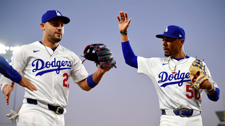 Aug 25, 2025; Los Angeles, California, USA; Los Angeles Dodgers outfielder Michael Conforto (23) reacts after a catch with shortstop Mookie Betts (50) in the second inning against the Cincinnati Reds at Dodger Stadium. Mandatory Credit: Gary A. Vasquez-Imagn Images Aug 25, 2025; Los Angeles, California, USA; Los Angeles Dodgers outfielder Michael Conforto (23) reacts after a catch with shortstop Mookie Betts (50) in the second inning against the Cincinnati Reds at Dodger Stadium. Mandatory Credit: Gary A. Vasquez-Imagn Images