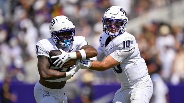 Sep 20, 2025; Fort Worth, Texas, USA; TCU Horned Frogs quarterback Josh Hoover (10) hands the ball off to running back Nate Palmer (21) during the game between the TCU Horned Frogs and the SMU Mustangs Sep 20, 2025; Fort Worth, Texas, USA; TCU Horned Frogs quarterback Josh Hoover (10) hands the ball off to running back Nate Palmer (21) during the game between the TCU Horned Frogs and the SMU Mustangs