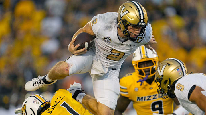 Sep 21, 2024; Columbia, Missouri, USA; Vanderbilt Commodores quarterback Diego Pavia (2) leaps over Missouri Tigers safety Marvin Burks Jr. (1) during overtime at Faurot Field at Memorial Stadium. Mandatory Credit: Jay Biggerstaff-Imagn Images Sep 21, 2024; Columbia, Missouri, USA; Vanderbilt Commodores quarterback Diego Pavia (2) leaps over Missouri Tigers safety Marvin Burks Jr. (1) during overtime at Faurot Field at Memorial Stadium. Mandatory Credit: Jay Biggerstaff-Imagn Images