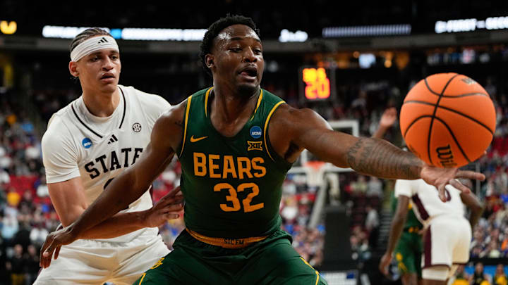 Mar 21, 2025; Raleigh, NC, USA; Baylor Bears guard Jalen Celestine (32) reaches for the ball defended by Mississippi State Bulldogs guard Riley Kugel (2) during the first half in the first round of the NCAA Tournament at Lenovo Center. Mandatory Credit: Bob Donnan-Imagn Images