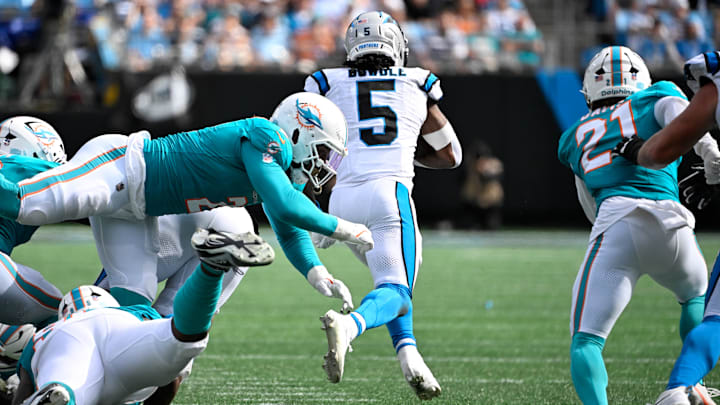 Carolina Panthers running back Rico Dowdle (5) runs as Miami Dolphins outside linebacker Bradley Chubb (2) and safety Ashtyn Davis (21) defend in the fourth quarter at Bank of America Stadium. Carolina Panthers running back Rico Dowdle (5) runs as Miami Dolphins outside linebacker Bradley Chubb (2) and safety Ashtyn Davis (21) defend in the fourth quarter at Bank of America Stadium.