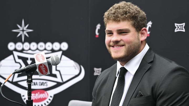 Jul 9, 2024; Las Vegas, NV, USA; Cincinnati offensive linemen Luke Kandra speaks to the media during the Big 12 Media Days at Allegiant Stadium. Mandatory Credit: Candice Ward-Imagn Images Jul 9, 2024; Las Vegas, NV, USA; Cincinnati offensive linemen Luke Kandra speaks to the media during the Big 12 Media Days at Allegiant Stadium. Mandatory Credit: Candice Ward-Imagn Images