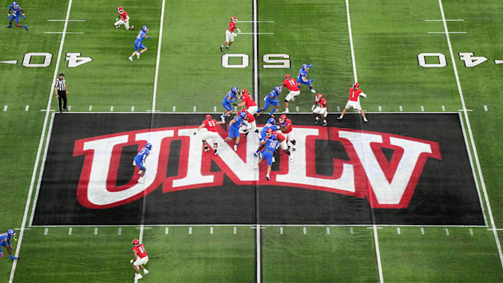 A general overall view as UNLV Rebels quarterback Jayden Maiava (1) throws the ball on the UNLV logo at midfield against the Boise State Broncos in the first half during the Mountain West Championship at Allegiant Stadium. Mandatory Credit: Kirby Lee-Imagn Images A general overall view as UNLV Rebels quarterback Jayden Maiava (1) throws the ball on the UNLV logo at midfield against the Boise State Broncos in the first half during the Mountain West Championship at Allegiant Stadium. Mandatory Credit: Kirby Lee-Imagn Images