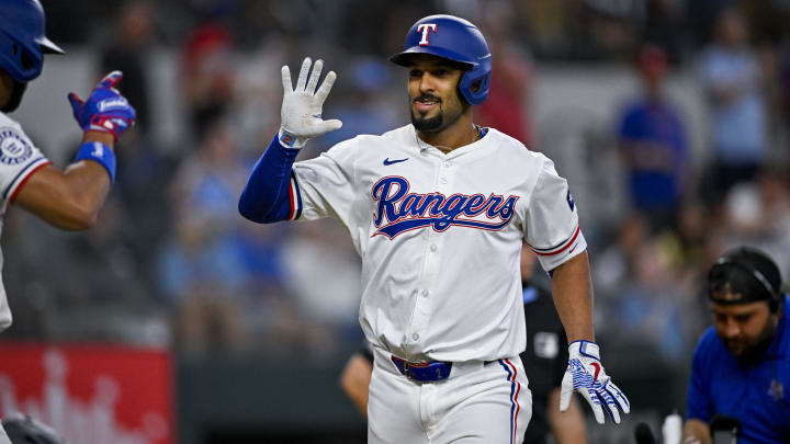 Jul 6, 2024; Arlington, Texas, USA; Texas Rangers second baseman Marcus Semien (2) celebrates during the game between the Texas Rangers and the Tampa Bay Rays at Globe Life Field. Mandatory Credit: Jerome Miron-USA TODAY Sports
