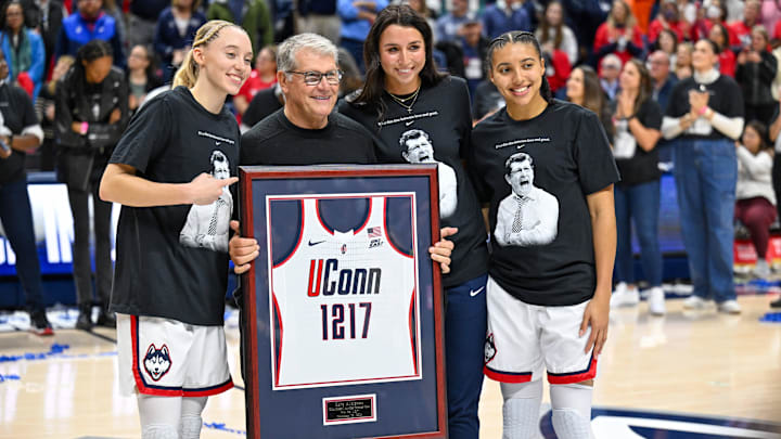 Connecticut Huskies guard Paige Bueckers (left) celebrates head coach Geno Auriemma setting the all time NCAA wins record with guard Azzi Fudd (35). Connecticut Huskies guard Paige Bueckers (left) celebrates head coach Geno Auriemma setting the all time NCAA wins record with guard Azzi Fudd (35).