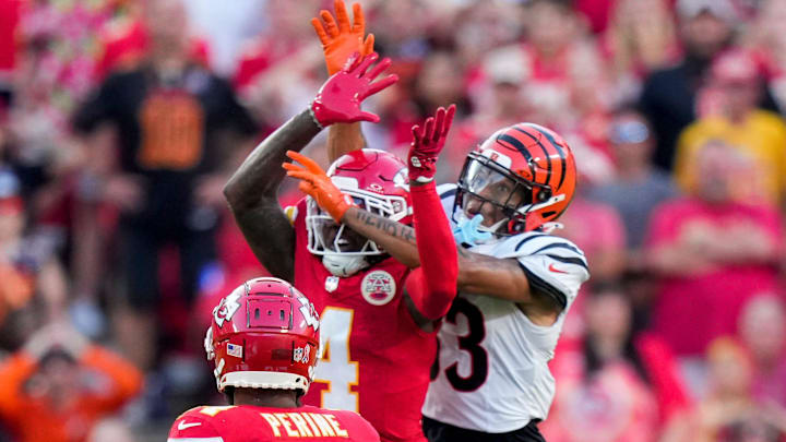 Kansas City Chiefs wide receiver Rashee Rice (4) and Cincinnati Bengals tight end Erick All Jr. (83) go up for a ball before the Bengals are penalized for pass interference in the fourth quarter of the NFL Week 2 game between the Kansas City Chiefs and the Cincinnati Bengals at Arrowhead Stadium in Kansas City on Sunday, Sept. 15, 2024. The Chiefs took a 26-25 win with a go-ahead field goal as time expired.