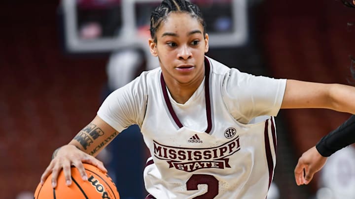 Mississippi State guard Jerkaila Jordan (2) moves the ball past Texas A & M guard Tineya Hylton (3) during the third quarter of the SEC Women's Basketball Tournament game three at the Bon Secours Wellness Arena in Greenville, S.C. Thursday, March 7, 2024.