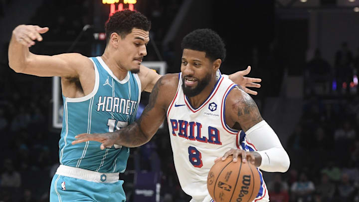 Dec 16, 2024; Charlotte, North Carolina, USA; Philadelphia 76ers forward Paul George (8) drives past Charlotte Hornets guard Josh Green (10) during the first half at the Spectrum Center. Mandatory Credit: Sam Sharpe-Imagn Images Dec 16, 2024; Charlotte, North Carolina, USA; Philadelphia 76ers forward Paul George (8) drives past Charlotte Hornets guard Josh Green (10) during the first half at the Spectrum Center. Mandatory Credit: Sam Sharpe-Imagn Images