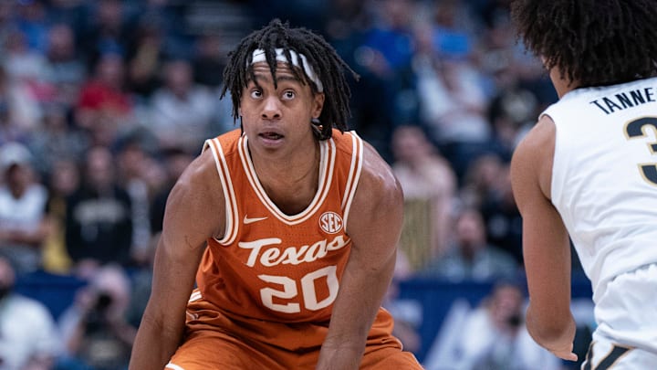 Texas Longhorns guard Tre Johnson (20) looks for an opening against Vanderbilt Commodores guard Tyler Tanner (3) during their first round game of the SEC Men's Basketball Tournament at Bridgestone Arena in Nashville, Tenn., Wednesday, March 12, 2025. Texas Longhorns guard Tre Johnson (20) looks for an opening against Vanderbilt Commodores guard Tyler Tanner (3) during their first round game of the SEC Men's Basketball Tournament at Bridgestone Arena in Nashville, Tenn., Wednesday, March 12, 2025.