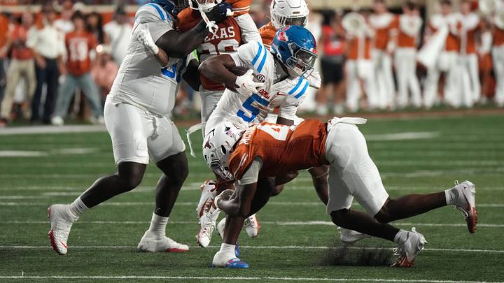 Oct 24, 2026; Austin, Texas, USA; Mississippi Rebels running back Kewan Lacy (5) is tackled by Texas Longhorns defensive back Jelani McDonald (4) during the first half at Darrell K Royal-Texas Memorial Stadium. Mandatory Credit: Scott Wachter-Imagn Images Oct 24, 2026; Austin, Texas, USA; Mississippi Rebels running back Kewan Lacy (5) is tackled by Texas Longhorns defensive back Jelani McDonald (4) during the first half at Darrell K Royal-Texas Memorial Stadium. Mandatory Credit: Scott Wachter-Imagn Images