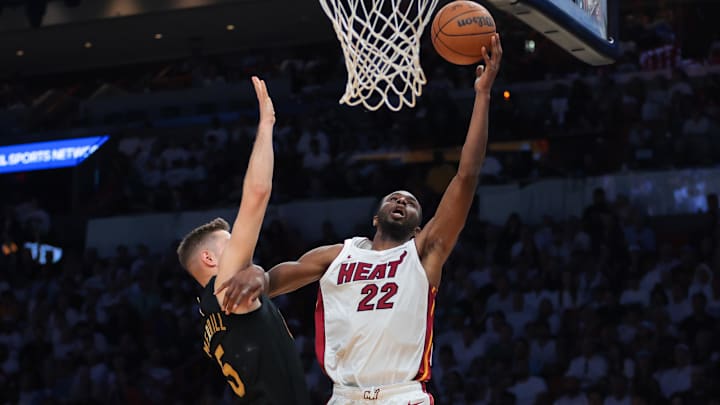 Apr 26, 2025; Miami, Florida, USA;Miami Heat forward Andrew Wiggins (22) drives to the basket against Cleveland Cavaliers guard Sam Merrill (5) in the third quarter during game three for the first round of the 2025 NBA Playoffs at Kaseya Center. Mandatory Credit: Sam Navarro-Imagn Images Apr 26, 2025; Miami, Florida, USA;Miami Heat forward Andrew Wiggins (22) drives to the basket against Cleveland Cavaliers guard Sam Merrill (5) in the third quarter during game three for the first round of the 2025 NBA Playoffs at Kaseya Center. Mandatory Credit: Sam Navarro-Imagn Images